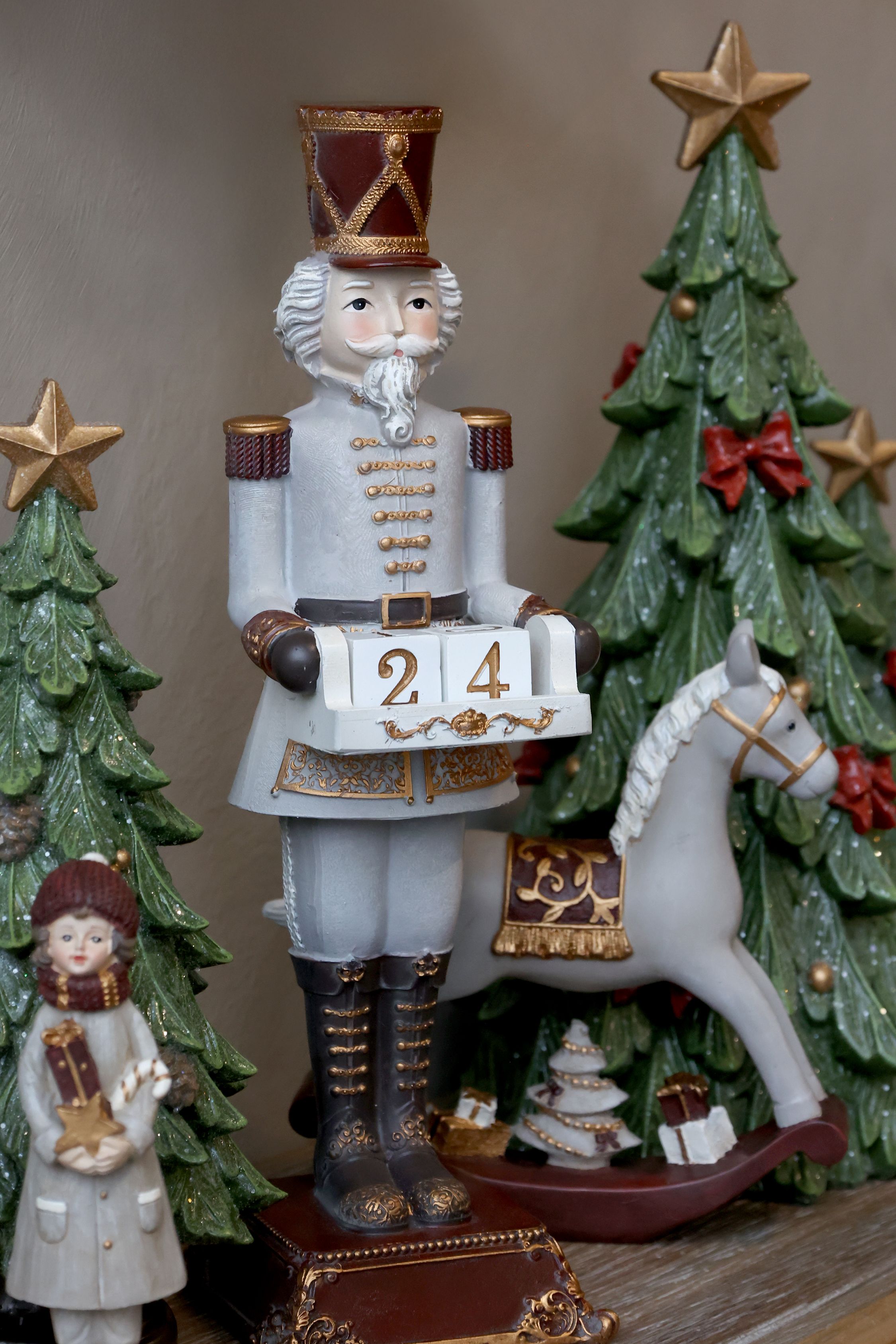 Noël Schaukelpferd mit Geschenken, Polyresin, 18 cm
